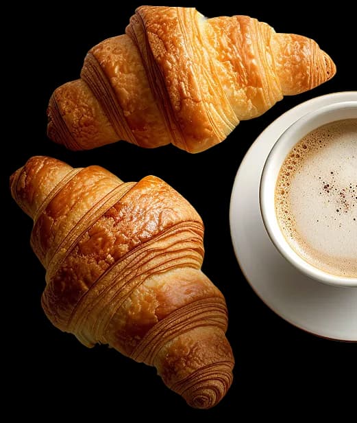 Croissants and coffee breakfast flat lay